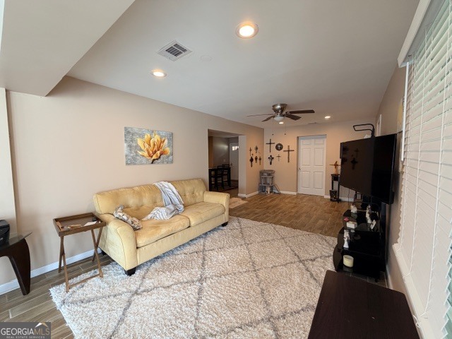 226 Lake Laurel Road Milledgeville, GA 31061 - Photo 10 of 25 a spacious bedroom with a bed a couch and a flat screen tv