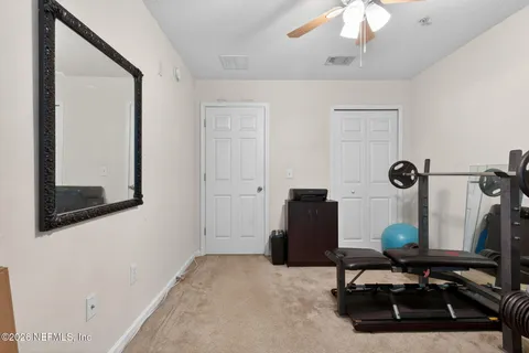 a view of workspace with mirror window and furniture
