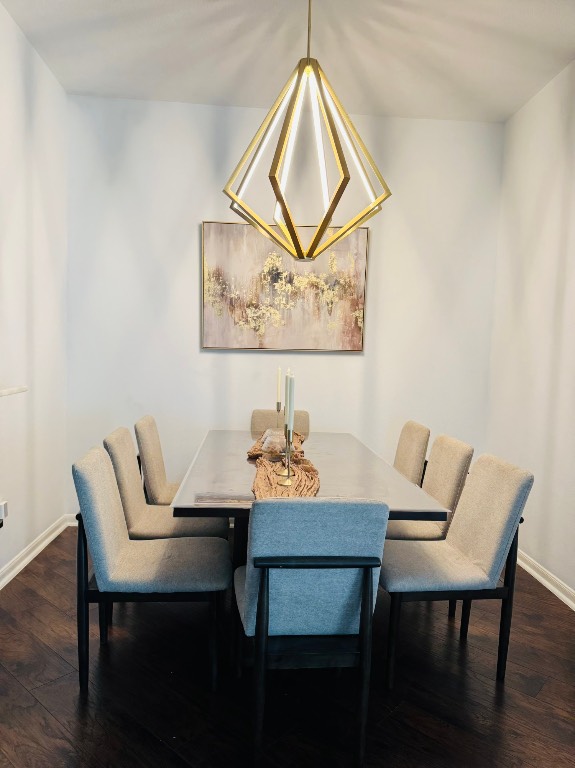 222 Doncaster Street Conroe, TX 77303 - Photo 11 of 33 a view of a dining room with furniture and wooden floor