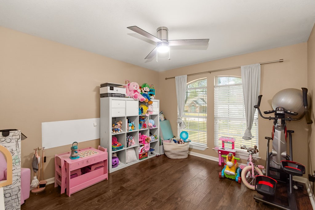 222 Doncaster Street Conroe, TX 77303 - Photo 21 of 33 a children room with toys and a wooden floor
