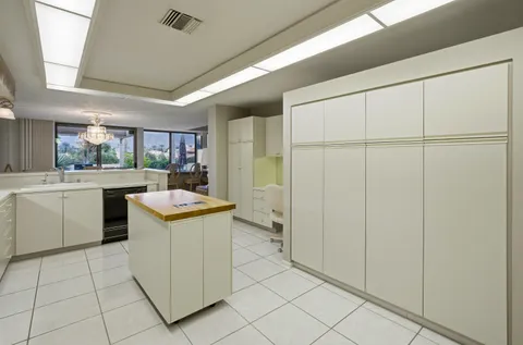 a kitchen with a stove a sink and a refrigerator
