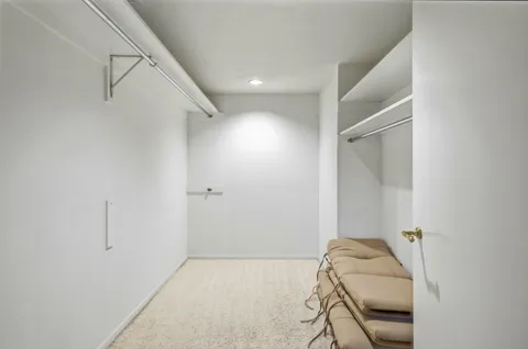 a view of a livingroom with white walls