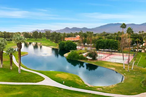 a view of a swimming pool with a lake view