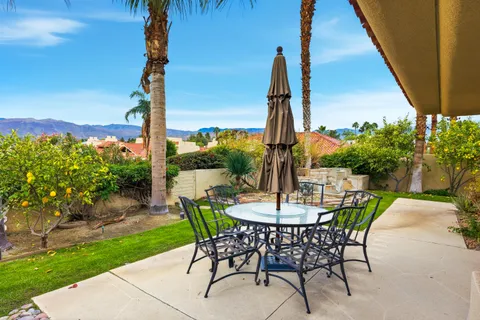 a view of an outdoor space with furniture and garden