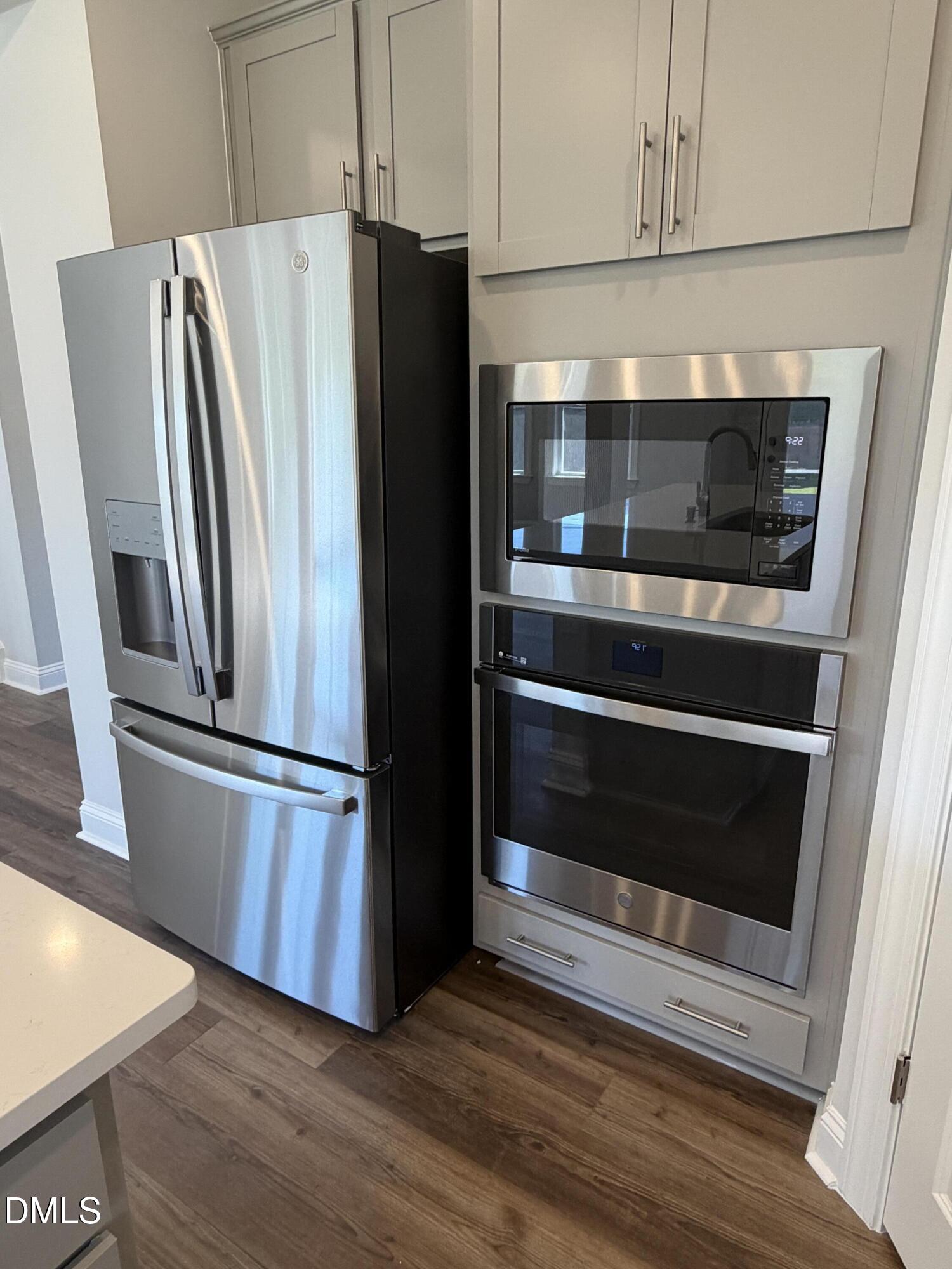 3016 Sandy Bluff Road Raleigh, NC 27616 - Photo 11 of 34 a metallic refrigerator freezer sitting in a kitchen
