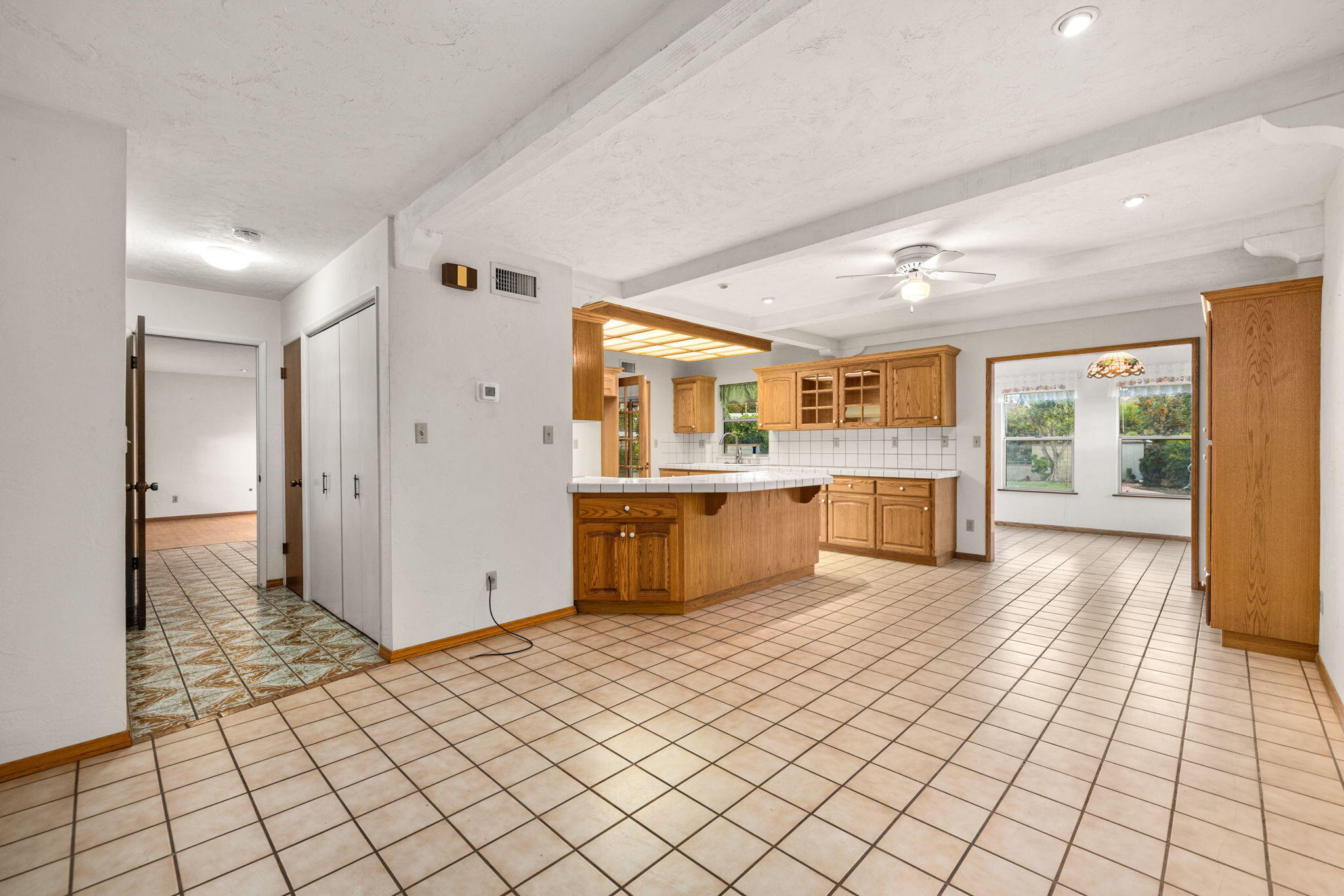 2428 Highland Road Upland, CA 91784 - Photo 17 of 45 a large kitchen with stainless steel appliances kitchen island granite countertop a refrigerator and a stove top oven