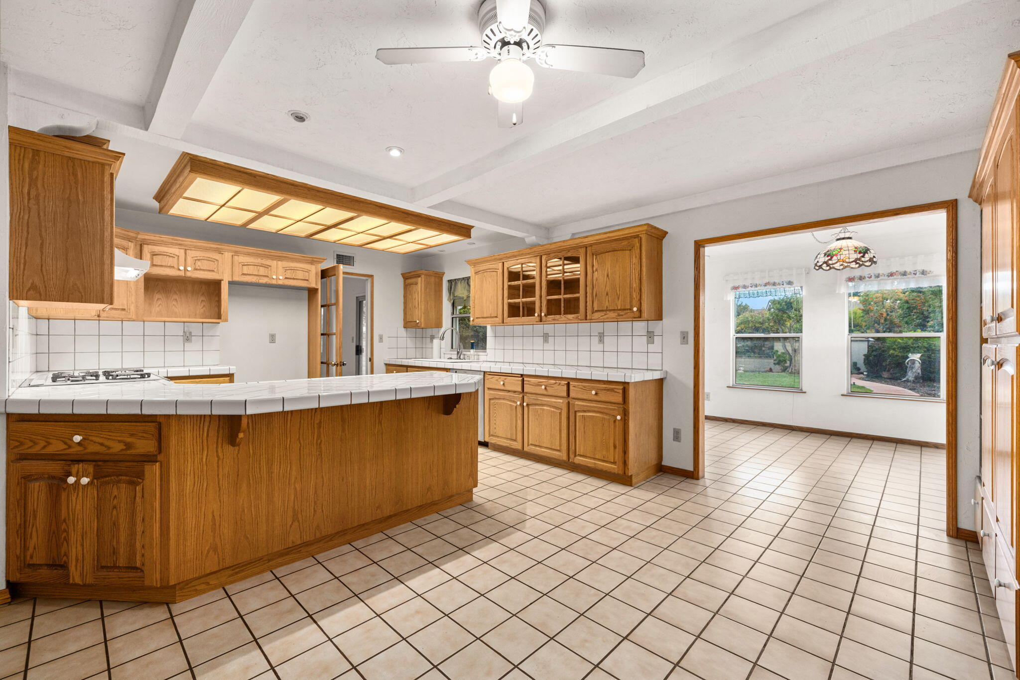 2428 Highland Road Upland, CA 91784 - Photo 18 of 45 a large kitchen with stainless steel appliances granite countertop a sink and cabinets