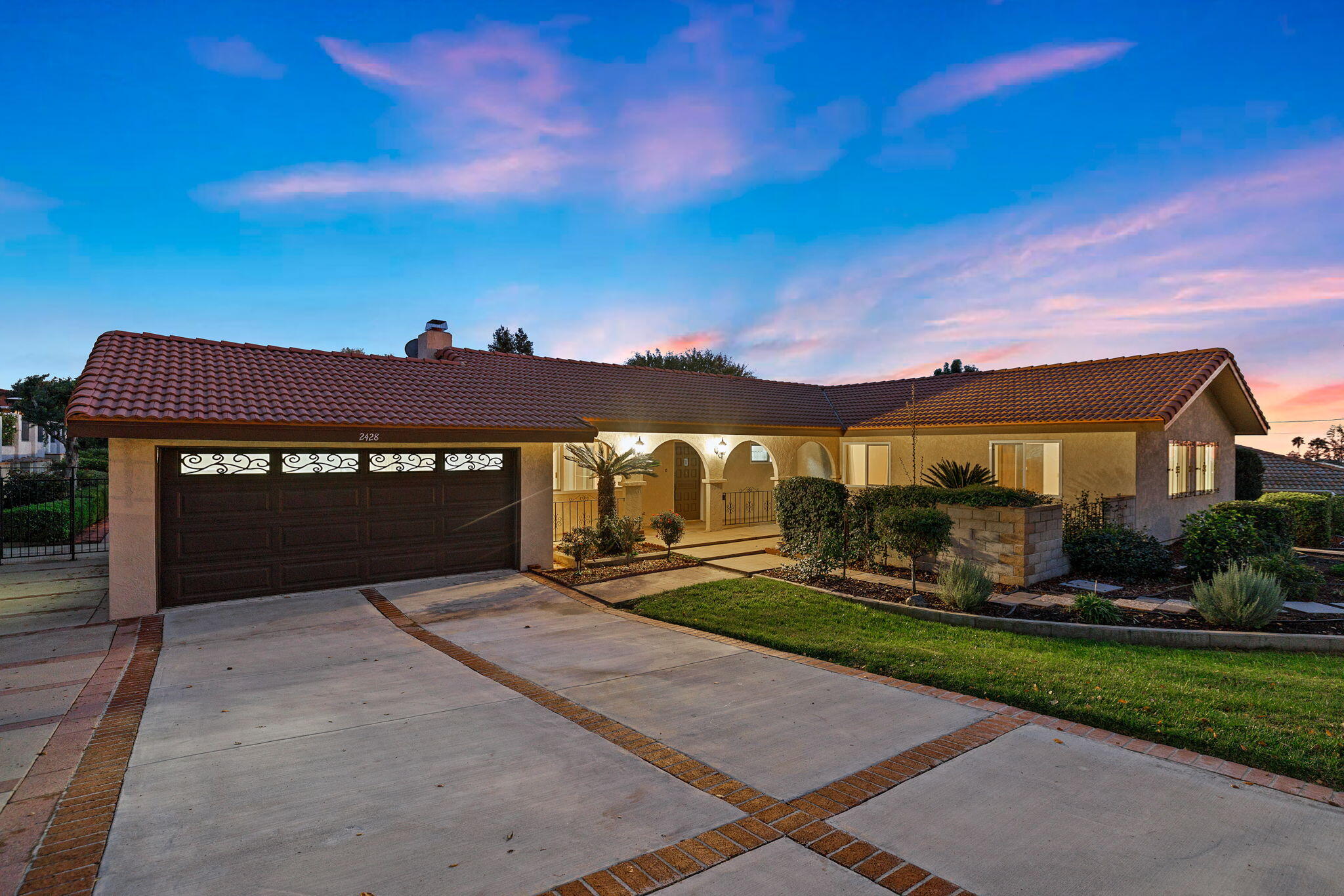 2428 Highland Road Upland, CA 91784 - Photo 2 of 45 a front view of a house with a yard