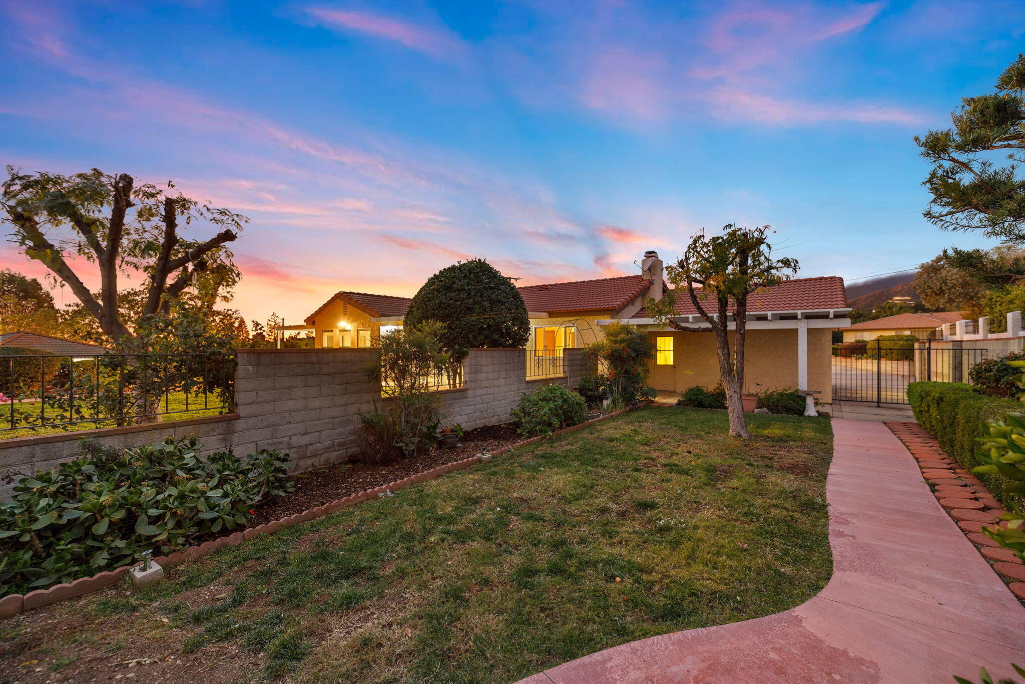 2428 Highland Road Upland, CA 91784 - Photo 36 of 45 a front view of a house with a yard