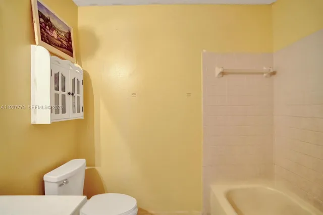 a bathroom with a toilet and a sink