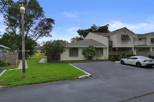 a view of a car parked in front of house