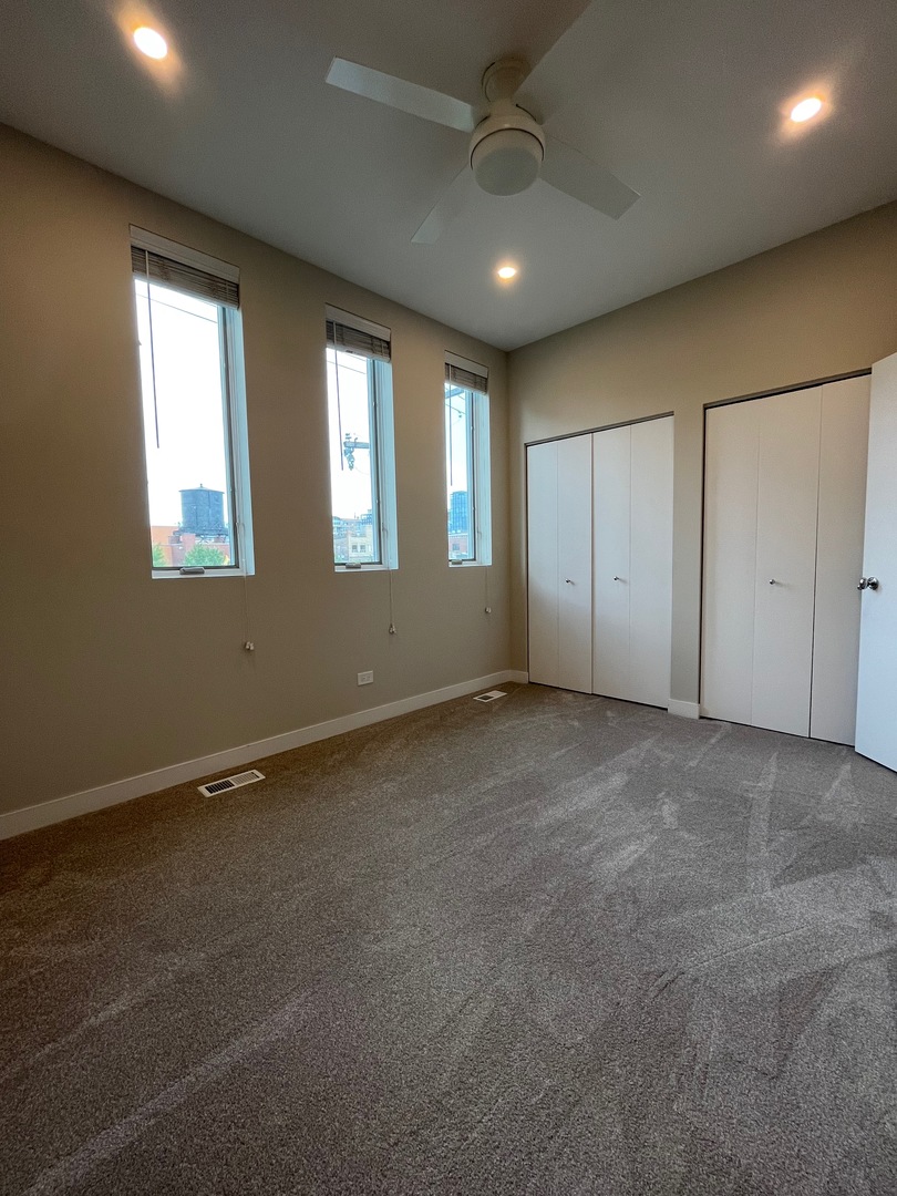 1246 West Cottage Place Chicago, IL 60607 - Photo 12 of 16 a view of an empty room with a window