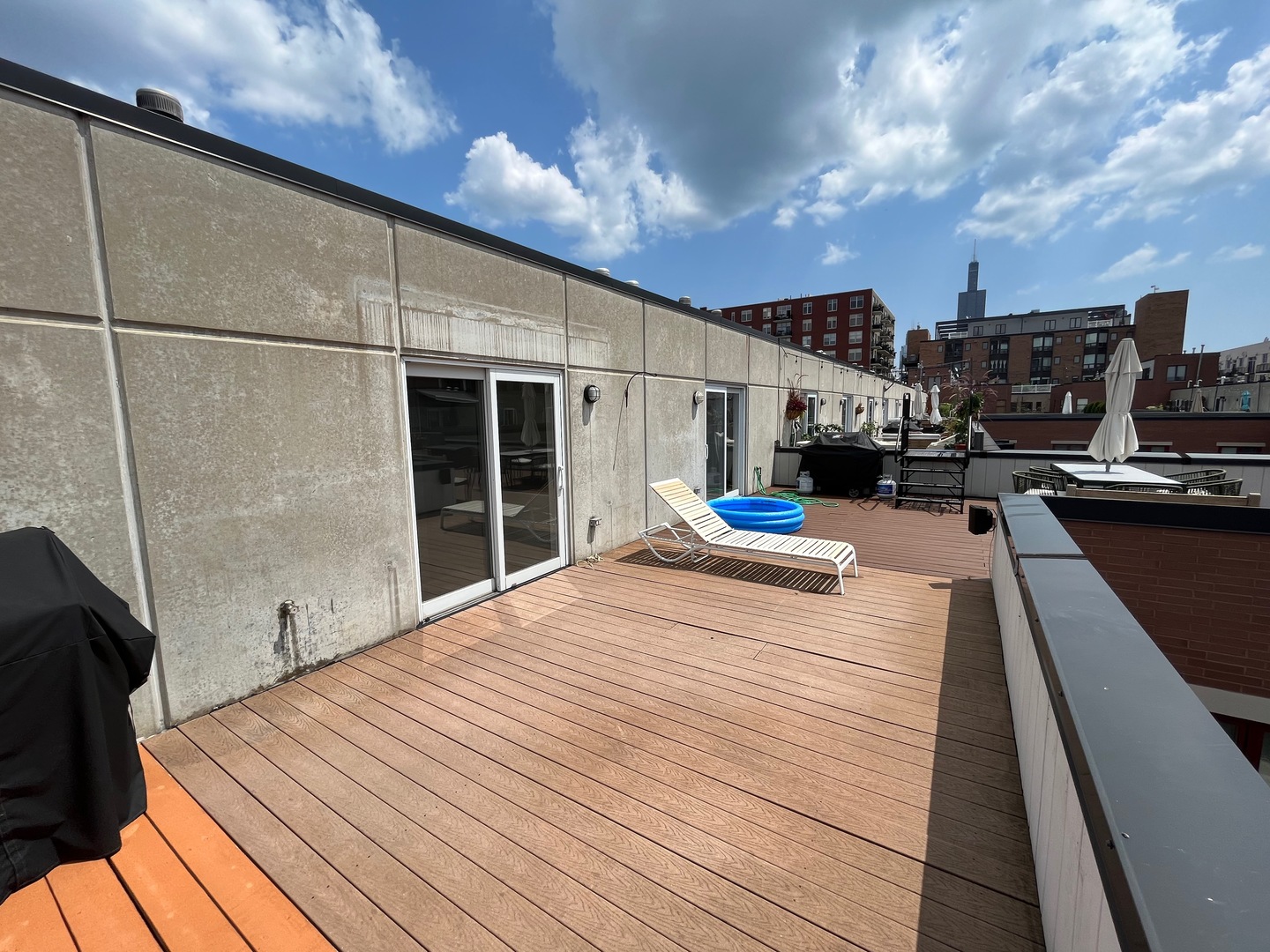 1246 West Cottage Place Chicago, IL 60607 - Photo 15 of 16 a outdoor space with wooden roof and city view