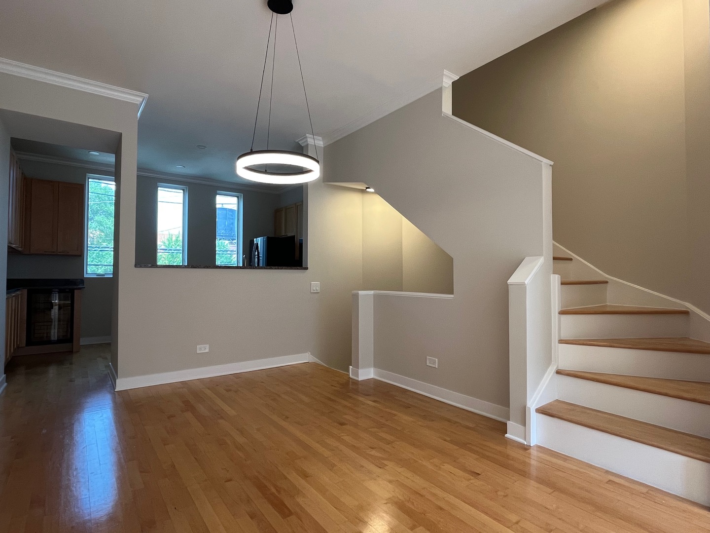 1246 West Cottage Place Chicago, IL 60607 - Photo 4 of 16 a view of a room with wooden floor and windows