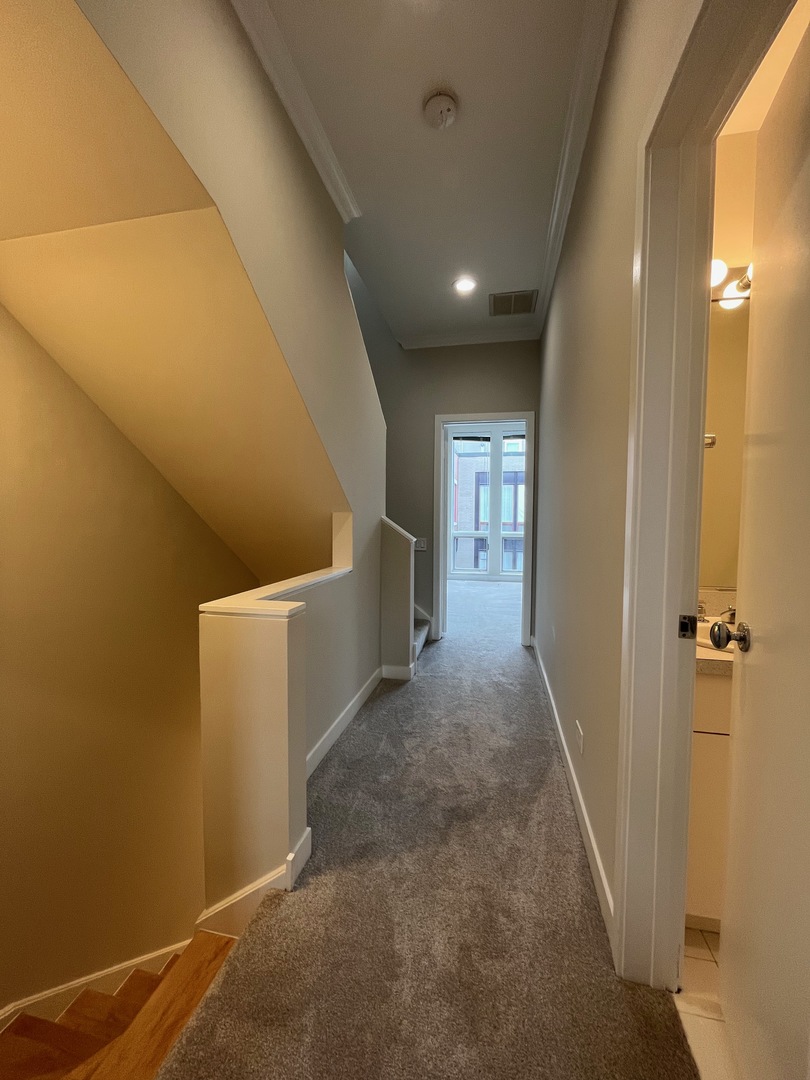 1246 West Cottage Place Chicago, IL 60607 - Photo 9 of 16 a view of a hallway to rooms