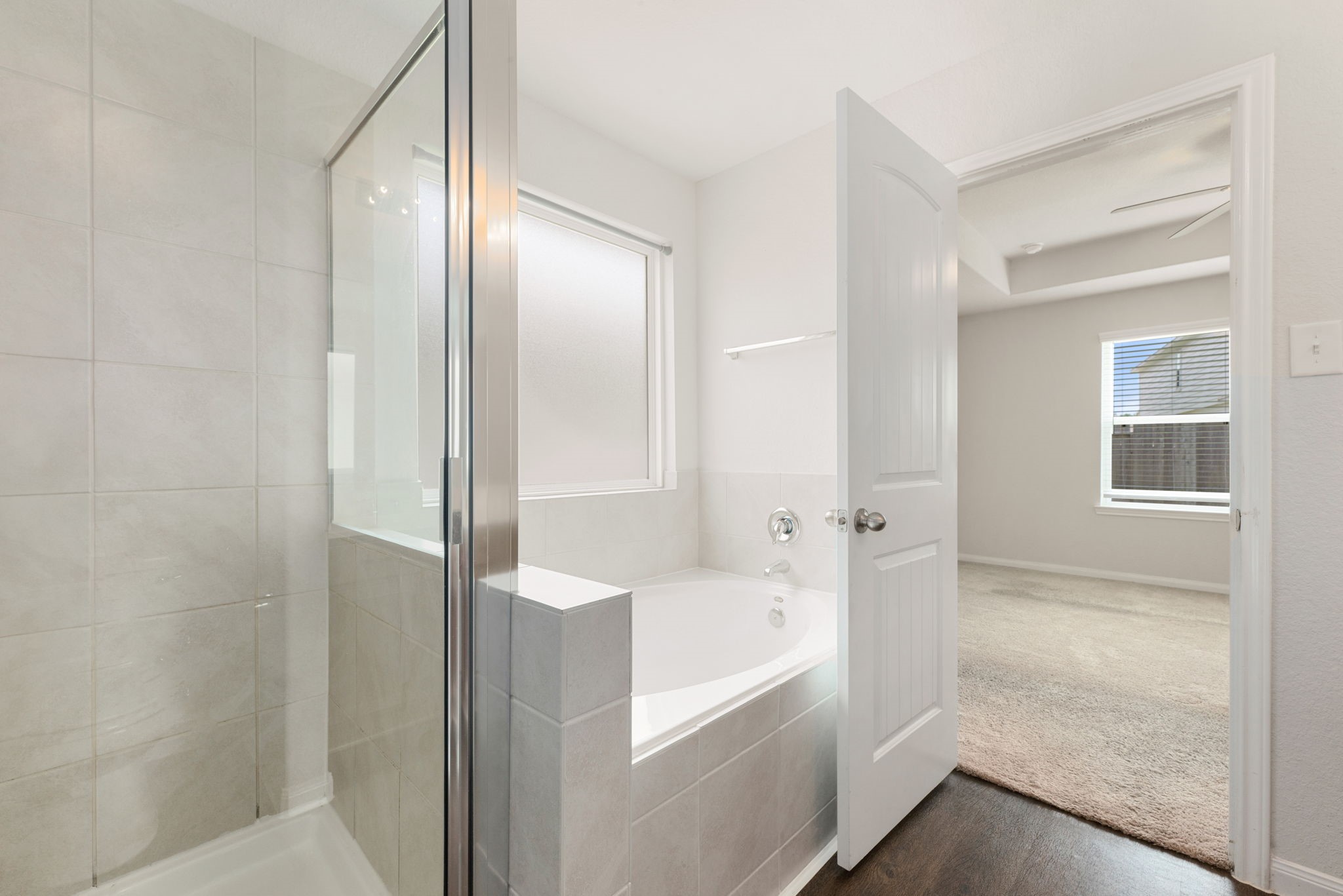 17555 Greystanes Road Humble, TX 77346 - Photo 13 of 28 a bathroom with a tub shower and sink