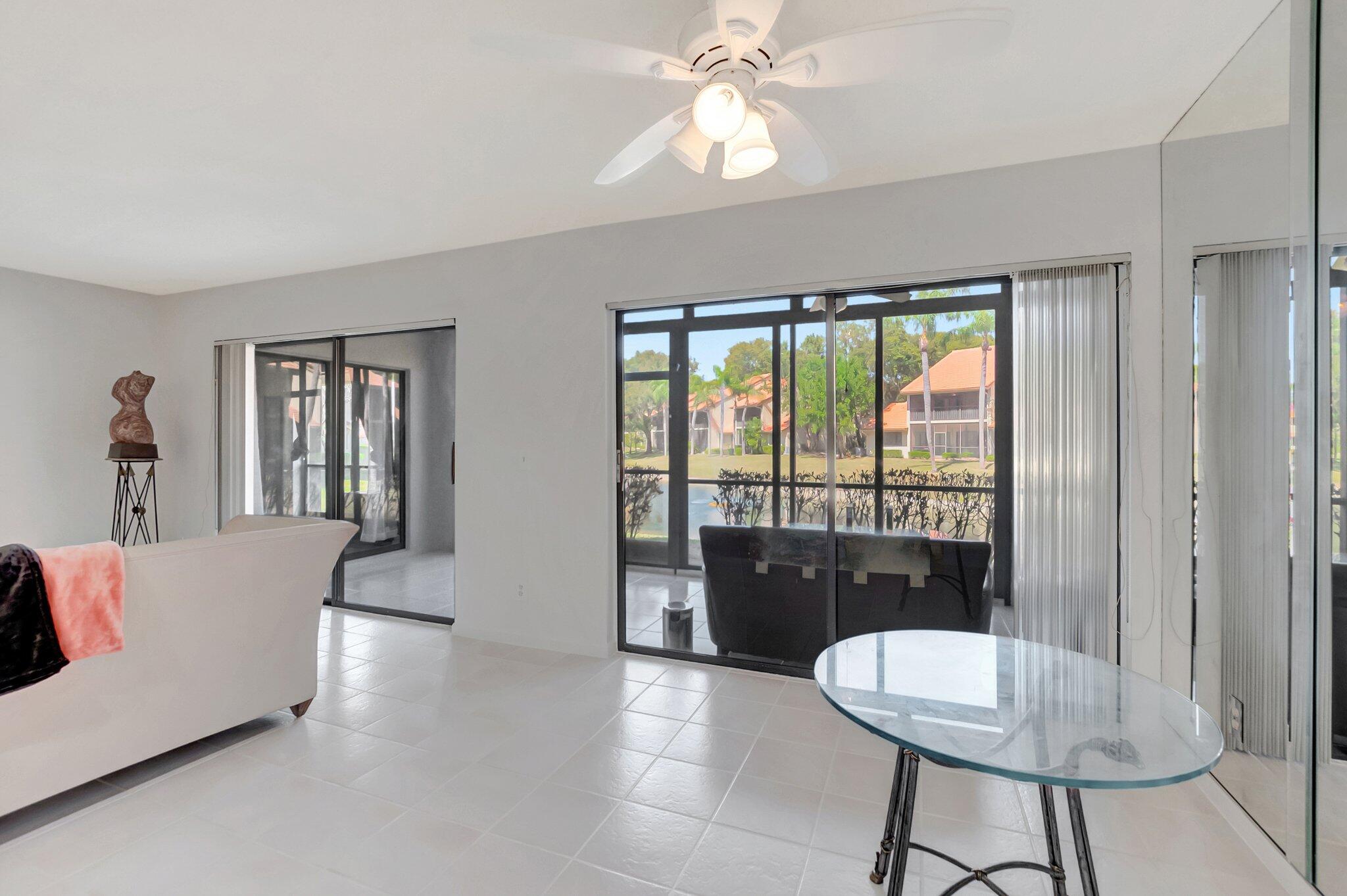5731 Coach House Circle, Unit A Boca Raton, FL 33486 - Photo 14 of 44 DINING AREA WITH LAKE VIEWS