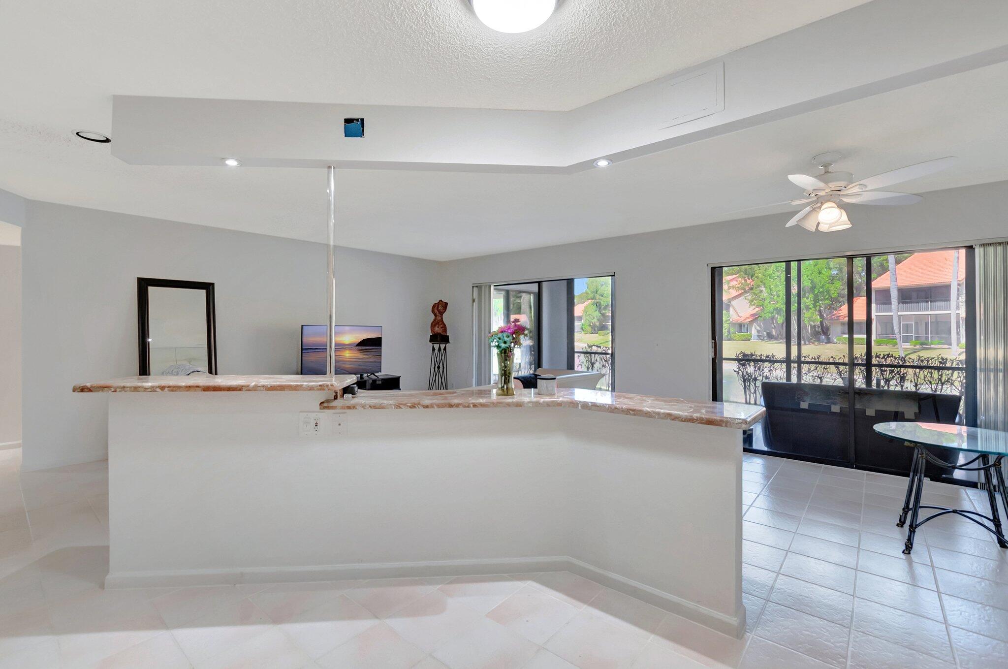 5731 Coach House Circle, Unit A Boca Raton, FL 33486 - Photo 19 of 44 KITCHEN ISLAND