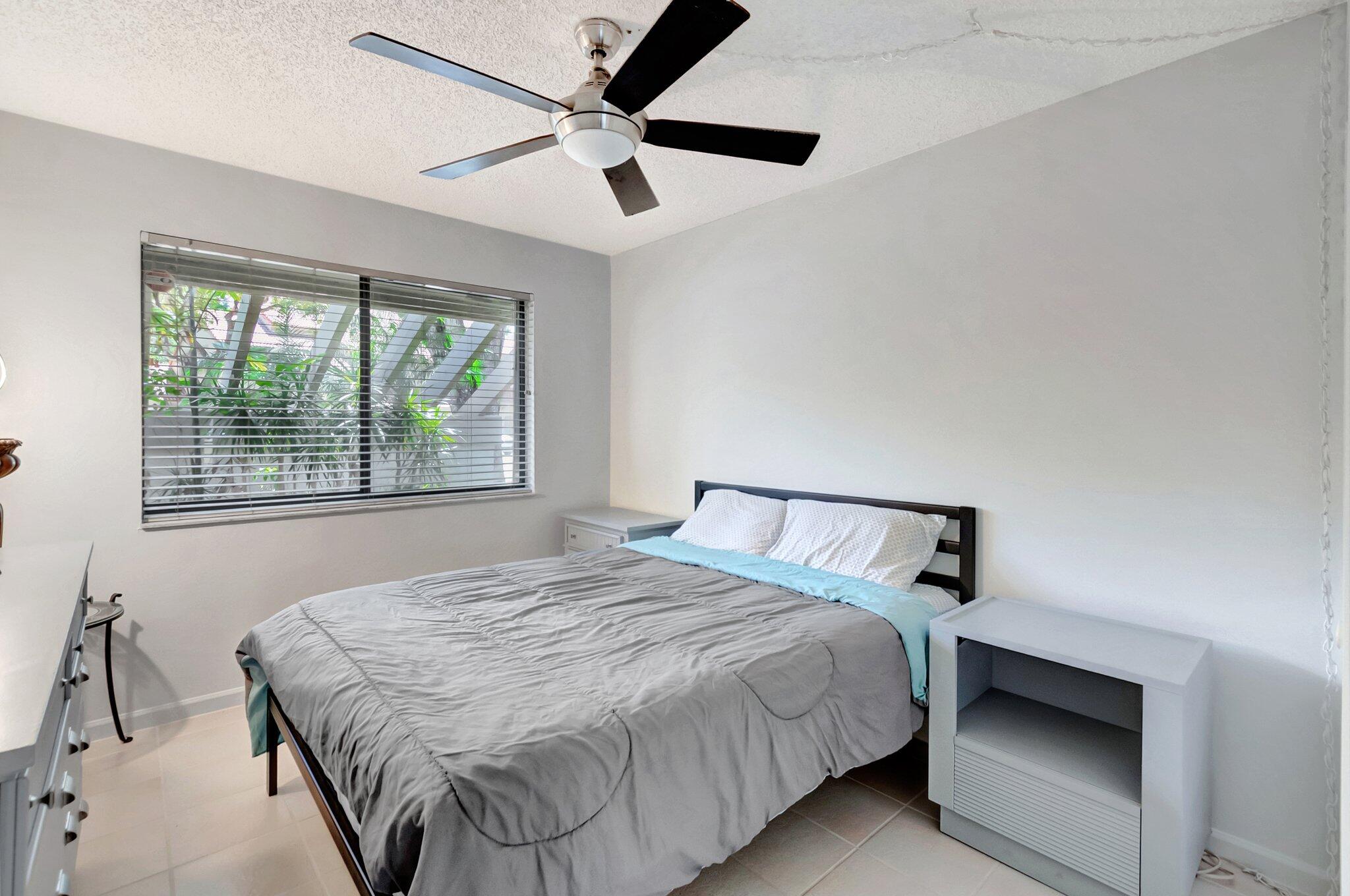 5731 Coach House Circle, Unit A Boca Raton, FL 33486 - Photo 26 of 44 SUNNY GUEST BEDROOM