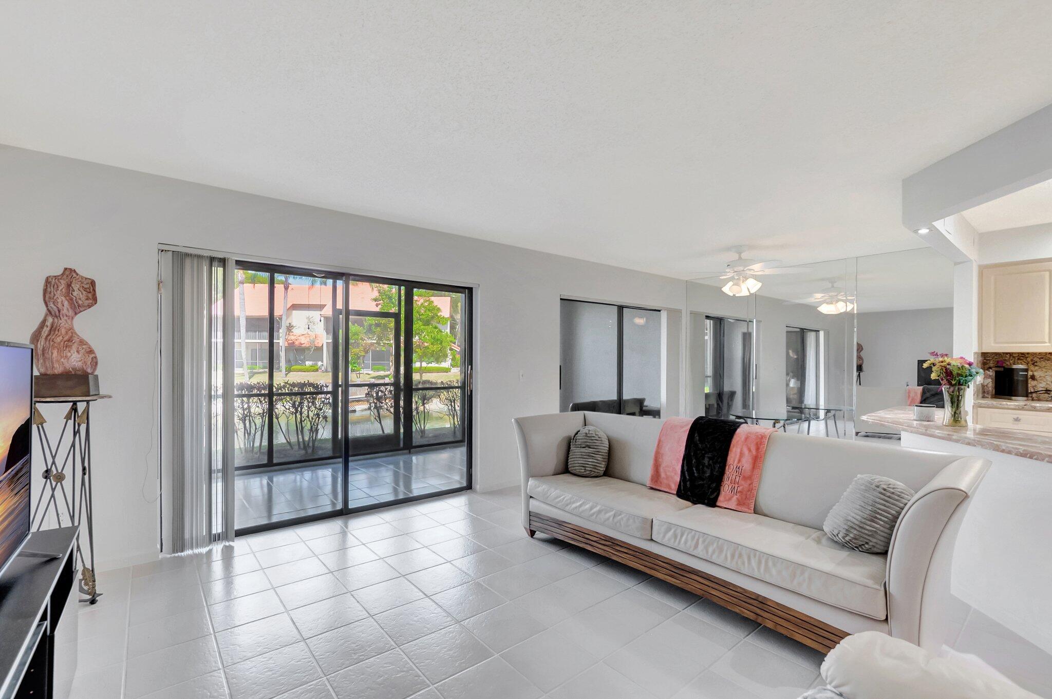 5731 Coach House Circle, Unit A Boca Raton, FL 33486 - Photo 7 of 44 BRIGHT OPEN LIVING ROOM