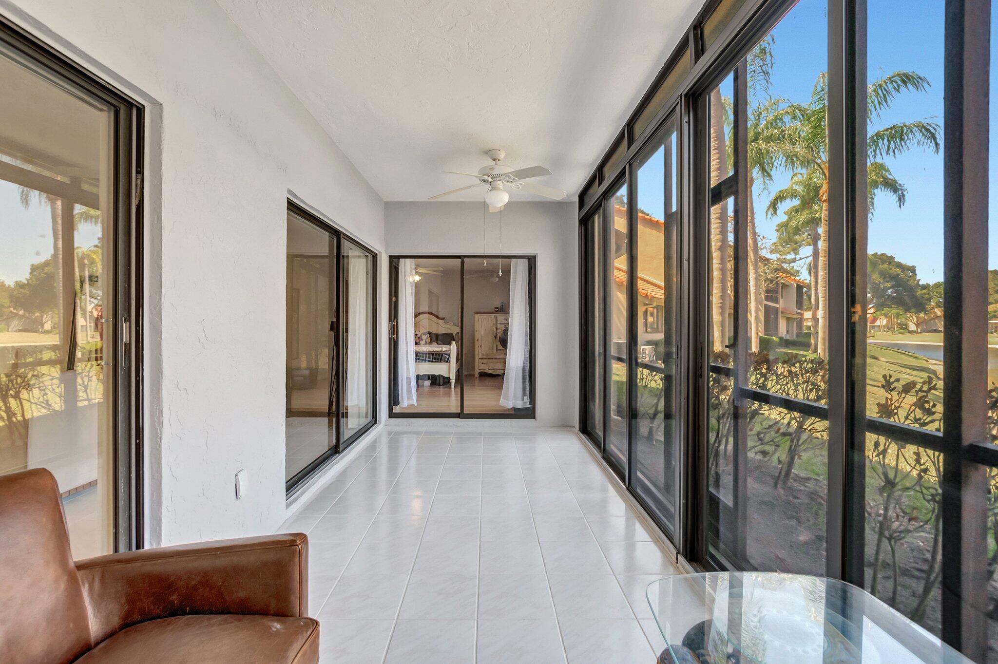 5731 Coach House Circle, Unit A Boca Raton, FL 33486 - Photo 9 of 44 SPACIOUS SCREENED/TILED PATIO