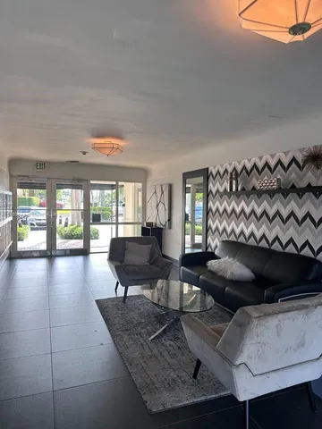 a view of a swimming pool with outdoor seating