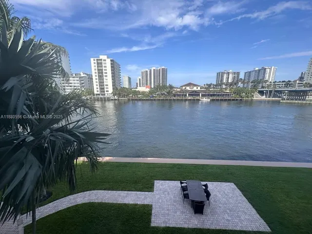 a view of a livingroom with stairs and furniture