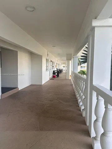 an aerial view of a swimming pool and lounge chairs