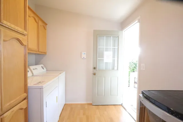 a view of a storage & utility room with a window