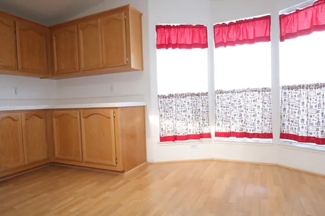 a view of a kitchen from the hallway