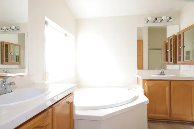 a view of room with window and ceiling fan