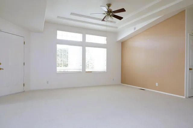 a view of empty room with a fireplace