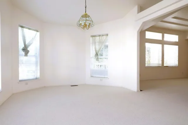 a view of a big room with closet and mirror