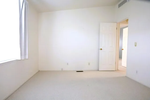 a view of a room that has a window in it