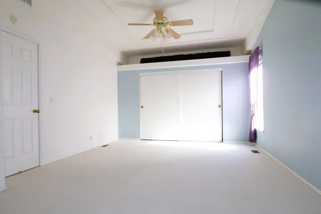 a view of empty room with fireplace