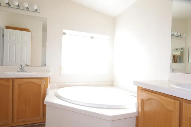 a bathroom with a bathtub and a sink