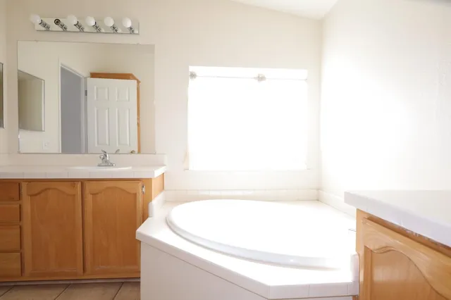 a bathroom with a bathtub and a sink