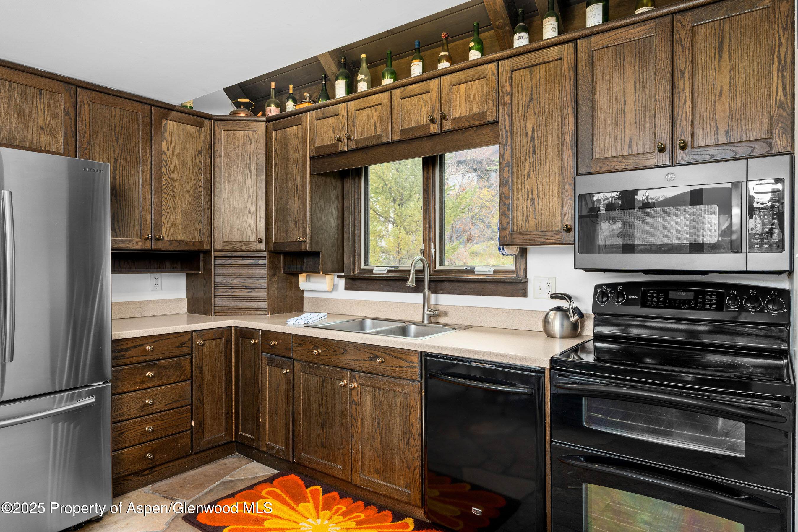 162 Bennett Bench Road Aspen, CO 81612 - Photo 16 of 46 a kitchen with a sink appliances and cabinets