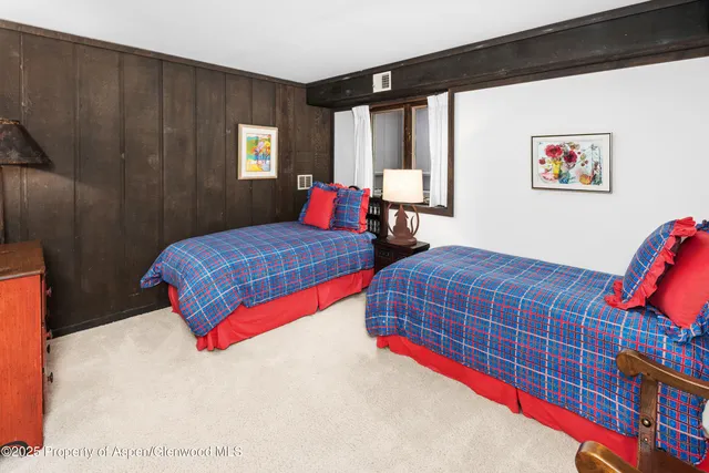 a room with furniture and air hockey table