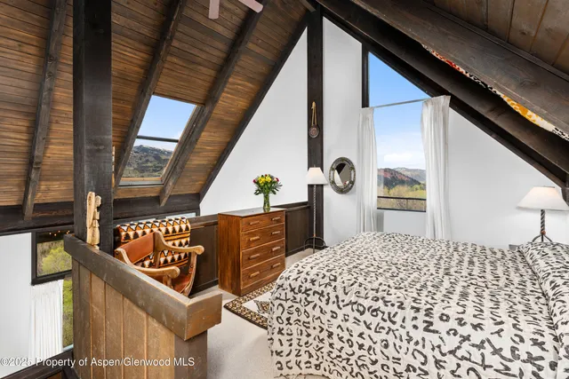 a view of a balcony with furniture