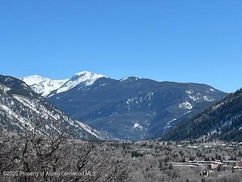 162 Bennett Bench Road Aspen, CO 81612 - Photo 46 of 46 a view of a large building with mountains in the background