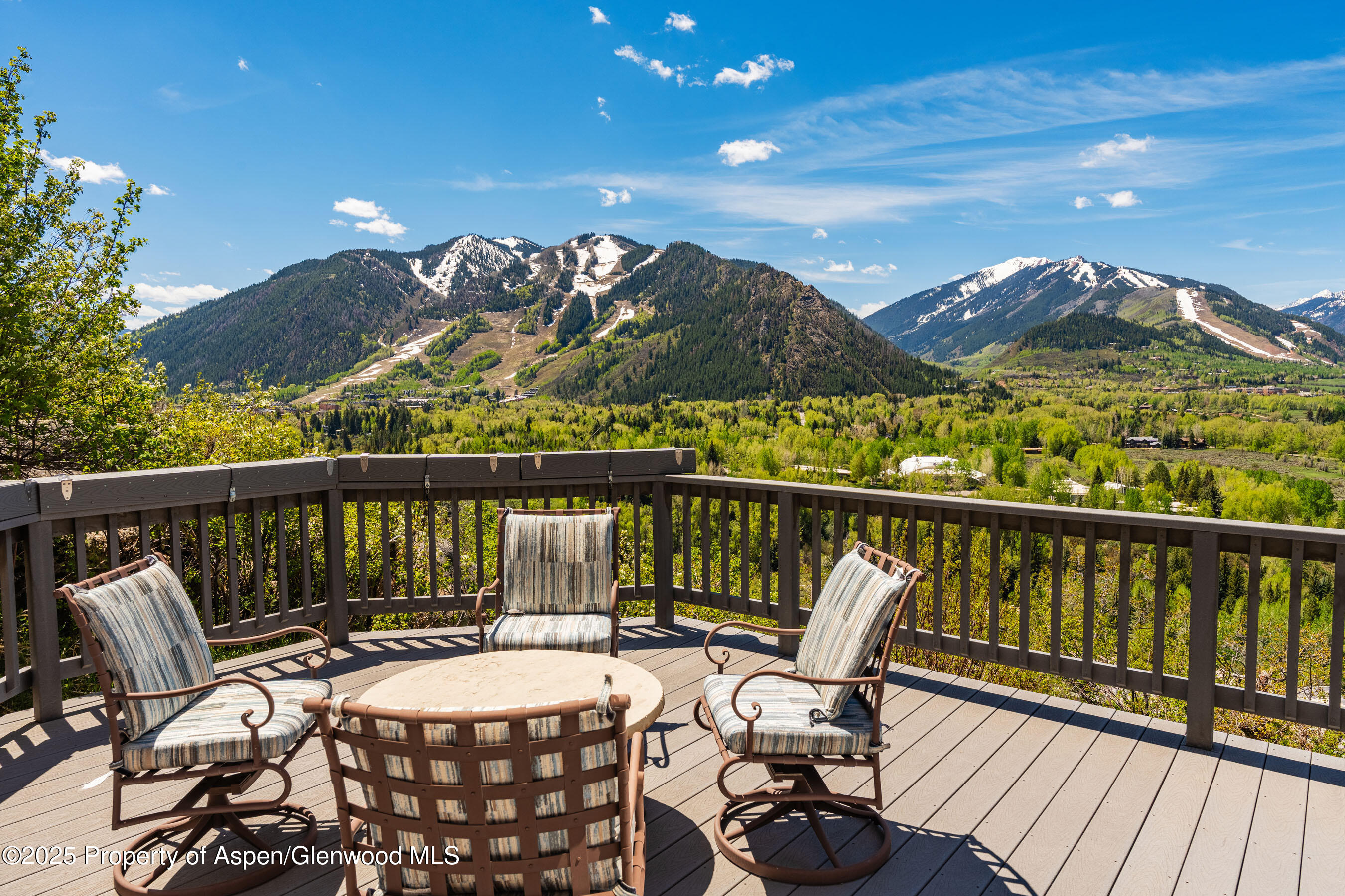 162 Bennett Bench Road Aspen, CO 81612 - Photo 5 of 46 a view of a balcony with chair and wooden floor