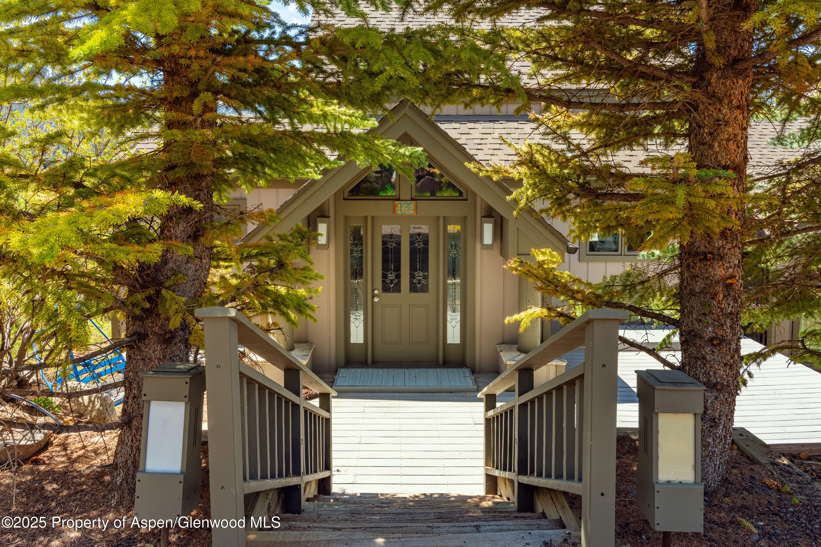 162 Bennett Bench Road Aspen, CO 81612 - Photo 7 of 46 a front view of a house with a tree