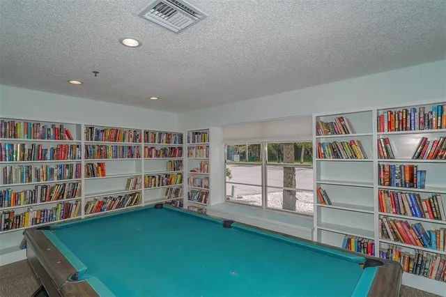 a view of a swimming pool with a yard