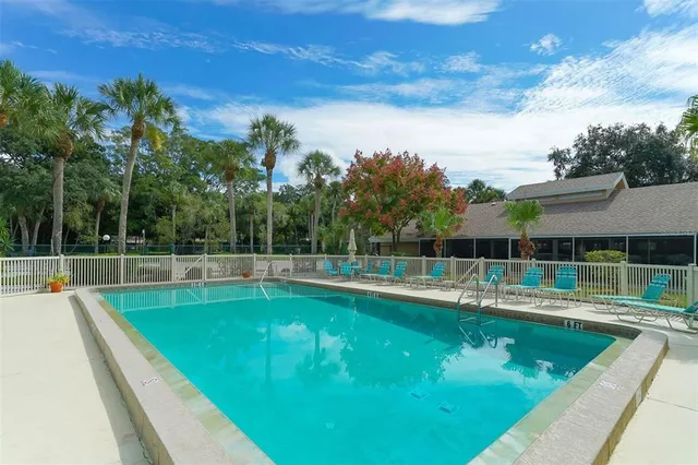 a view of a patio with a dining table and chairs