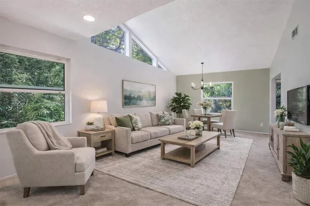 a view of an empty room with window and closet