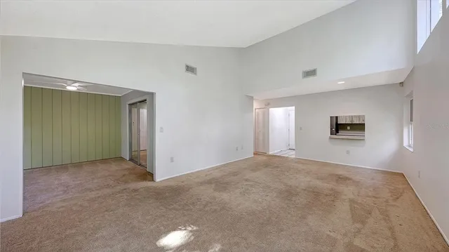 a view of a room with windows and wooden floor