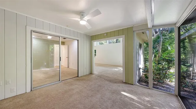 a view of a dining room with furniture and window