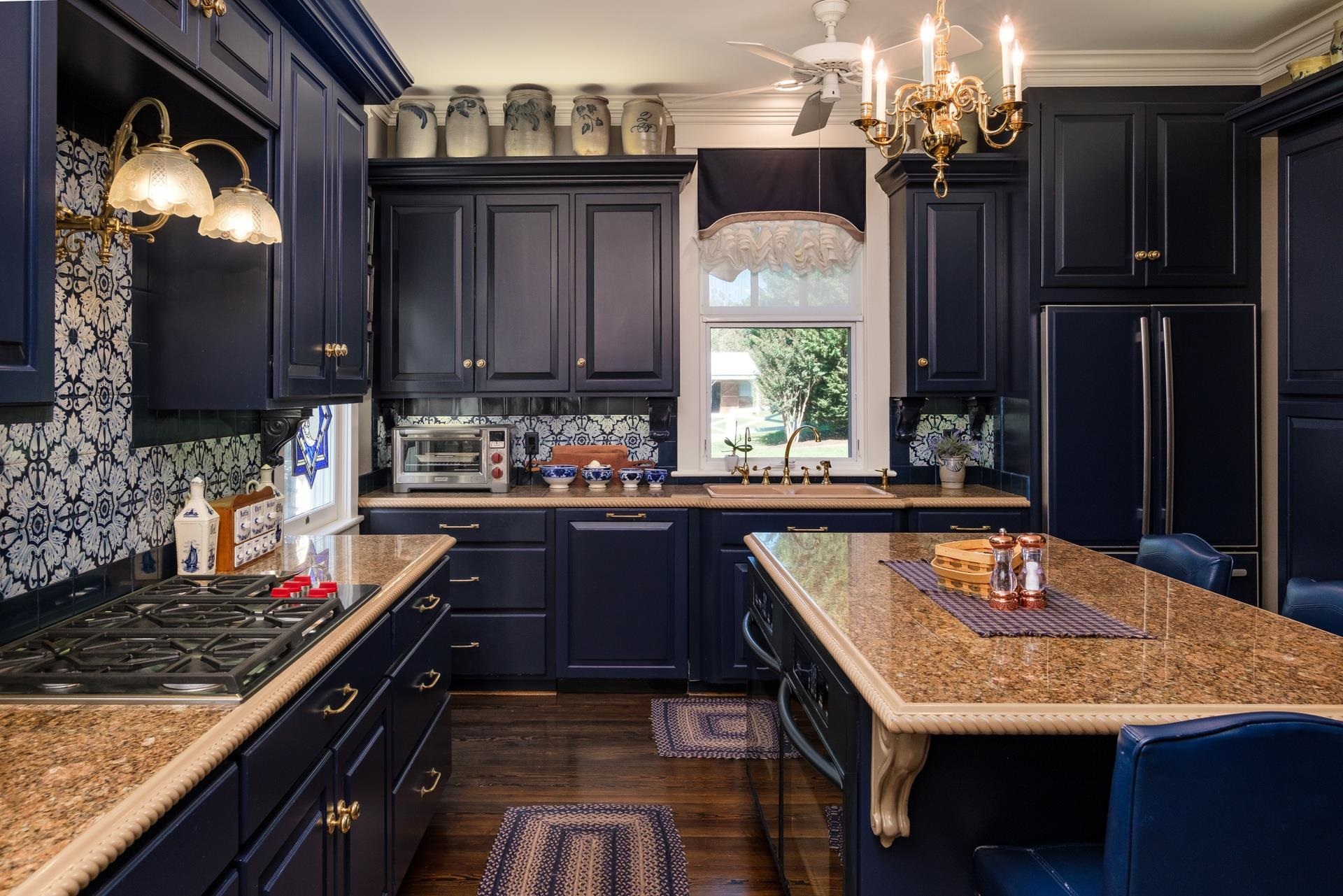 1739 Barterbrook Road Staunton, VA 24401 - Photo 35 of 74 a kitchen with granite countertop a stove a sink dishwasher and cabinets with wooden floor