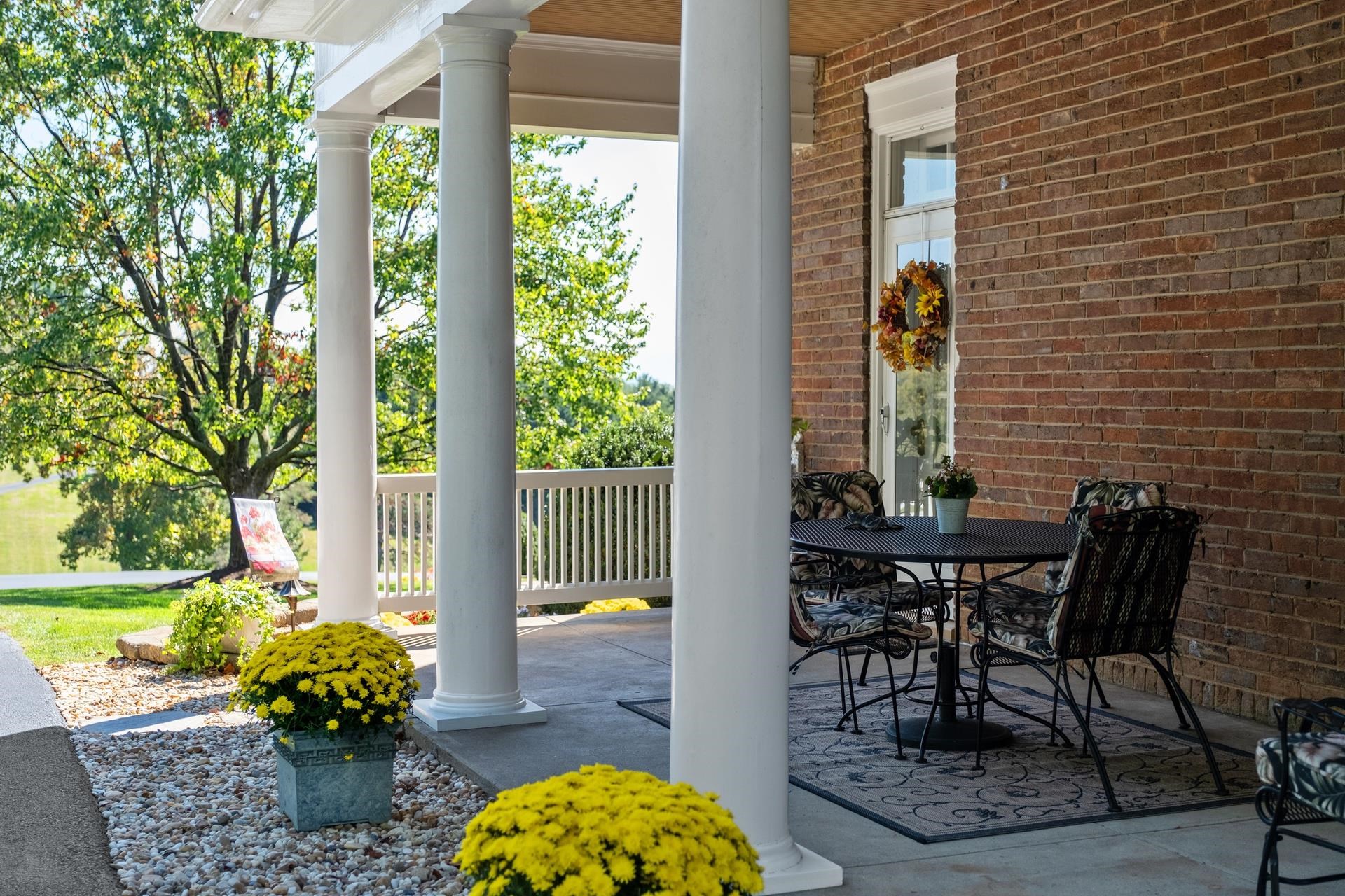 1739 Barterbrook Road Staunton, VA 24401 - Photo 64 of 74 a view of a porch with chairs and a potted plant